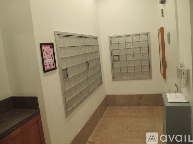 A wall with a calendar and a mailbox.