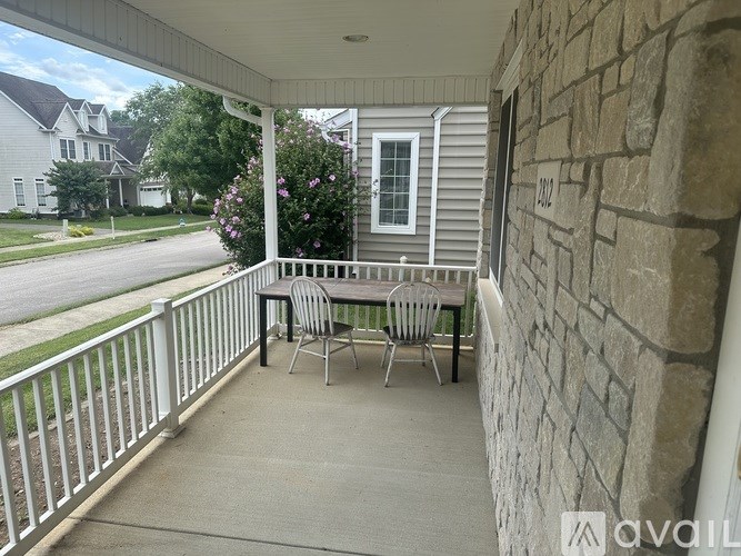 A patio with a table and chairs is available for rent.