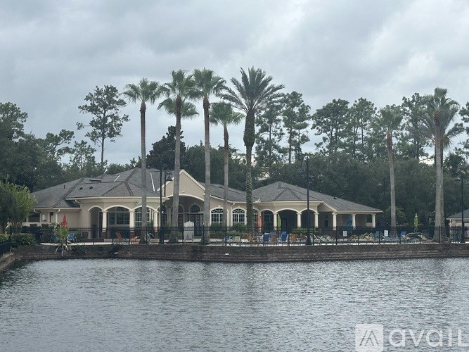 A large house with a pool in front of it.