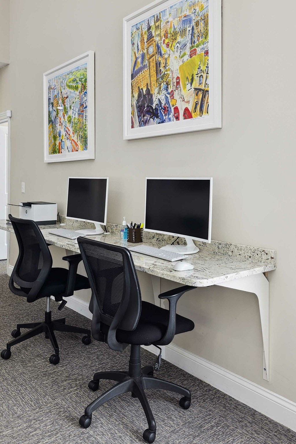A living room with a grey couch, a wooden chair, and a coffee table.