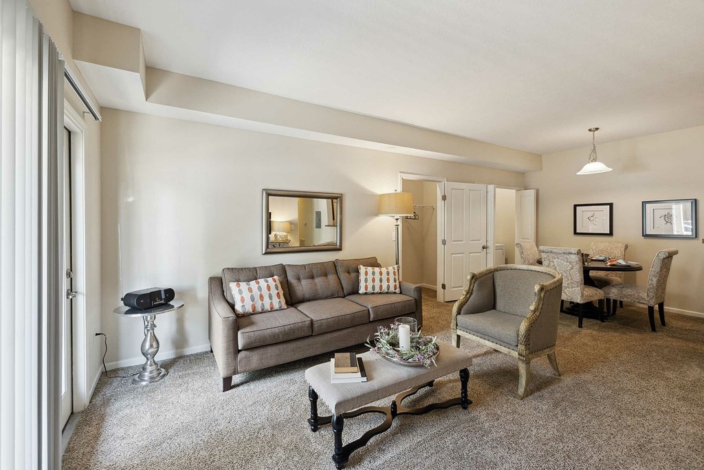 A large house with a front yard and a sign in front of it.