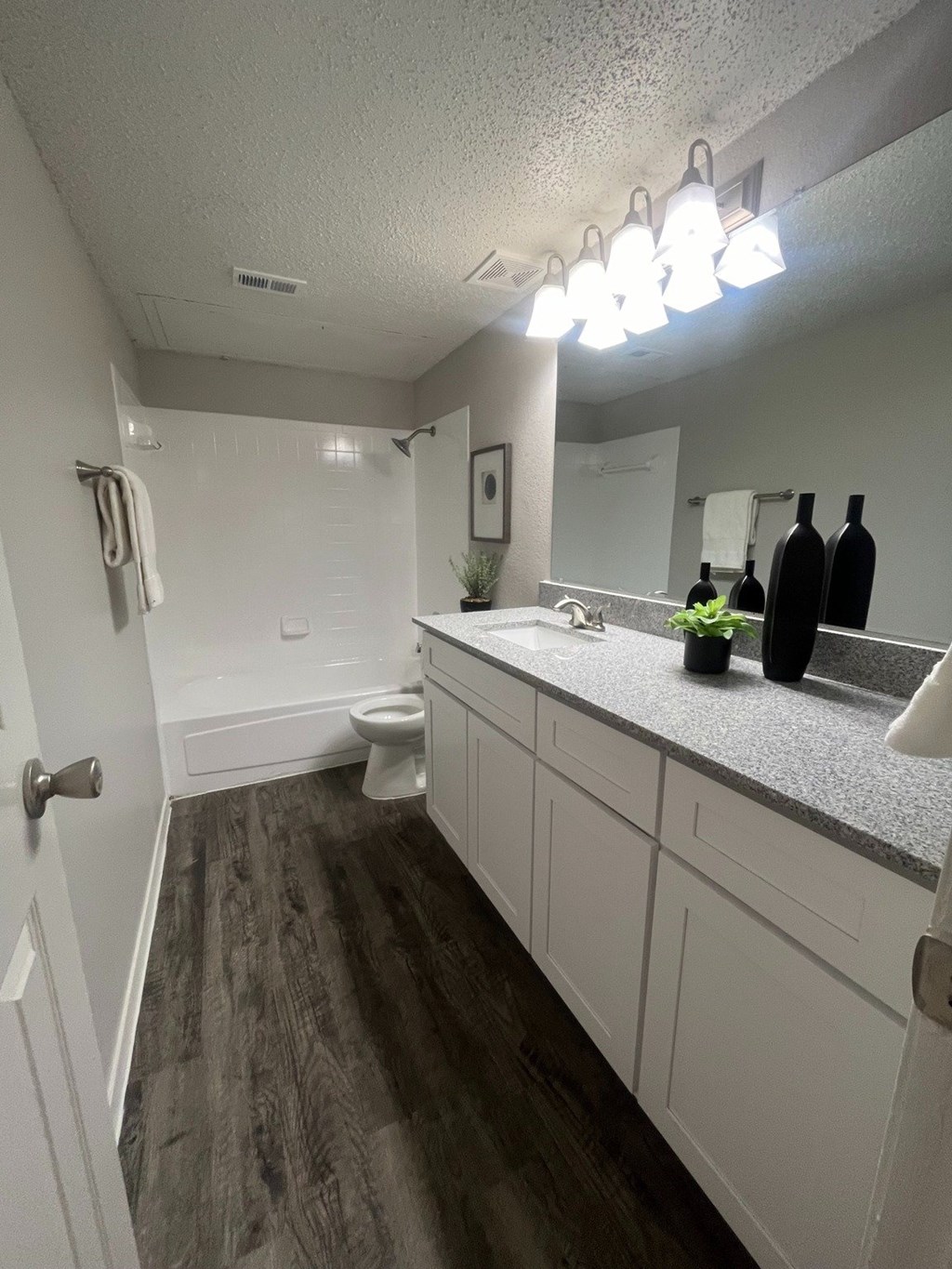 A bathroom with a white toilet and a white sink.