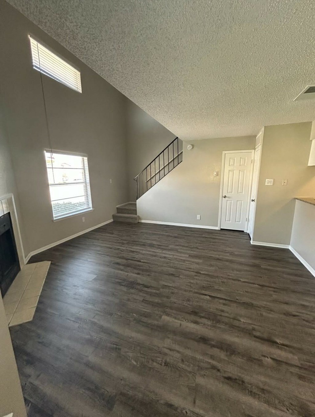 A room with a staircase and a window.