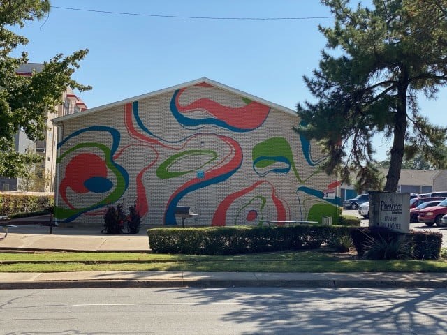 A building with a colorful mural on its side.