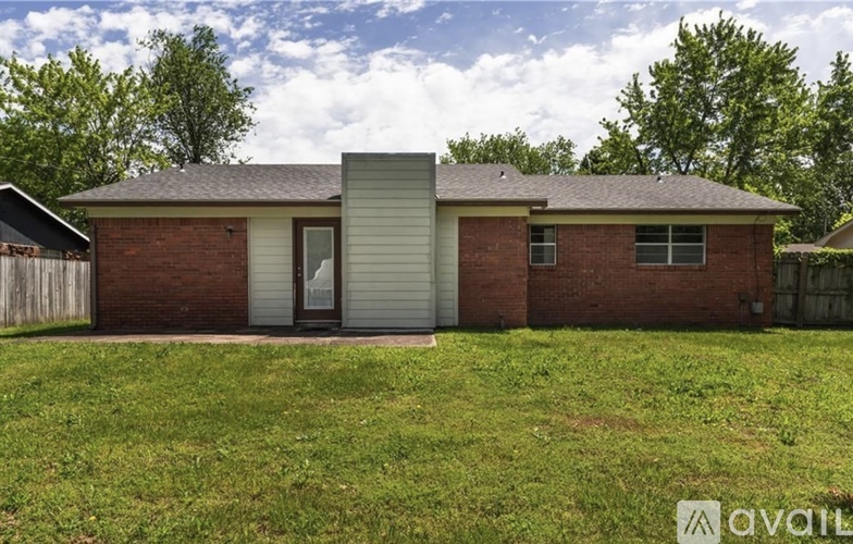A house with a garage door is for sale.