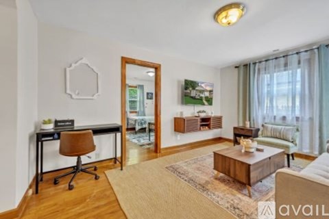 A living room with a brown chair and a brown coffee table.