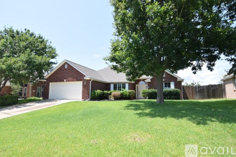 A house with a brown roof and a white garage door.