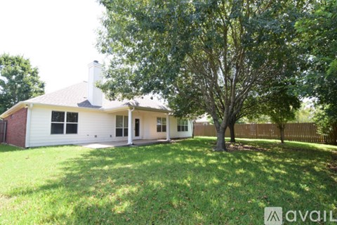 A house with a tree in front of it.