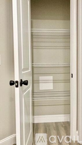 A white door with a glass panel and a black handle.