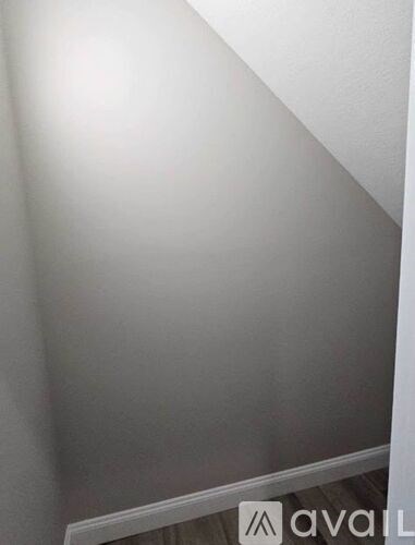 A white wall with a logo that says "avail" on it.