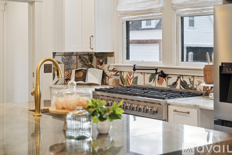 A kitchen with a stove top oven and a counter top.