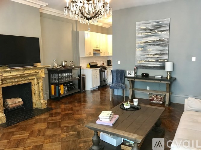 A living room with a fireplace and a television.