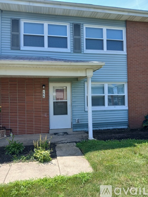 A house with a white door and windows.