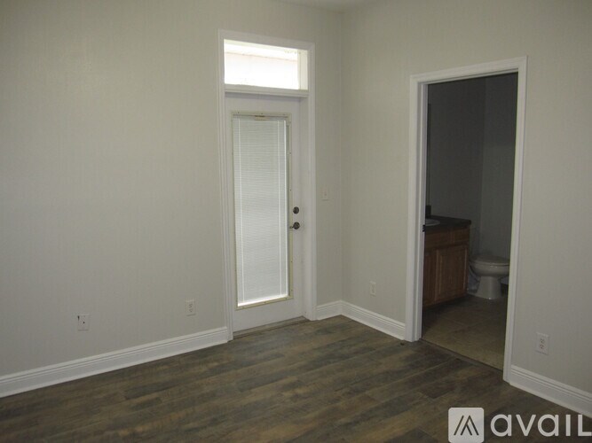 A room with a door and a window.