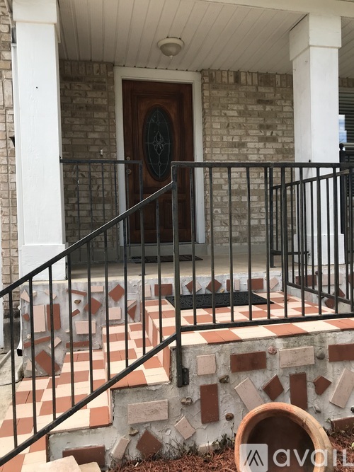 A black metal railing on a staircase.