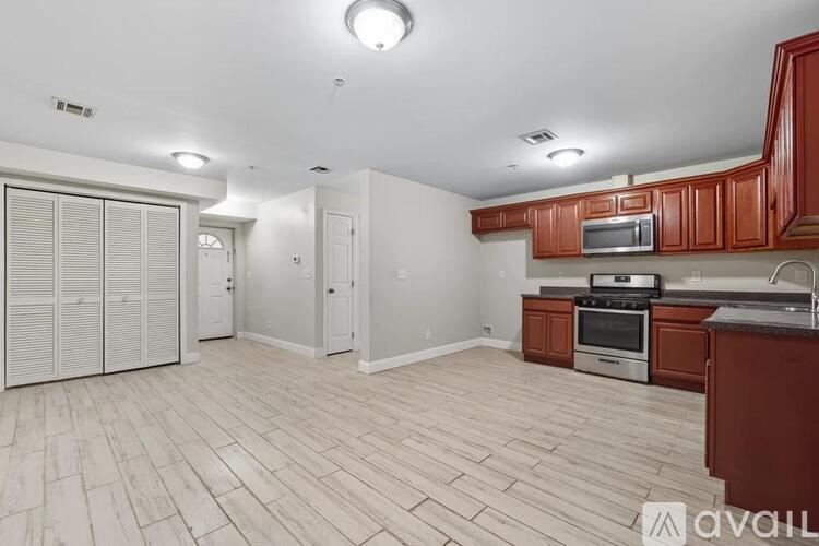 A room with white doors and a wooden floor.