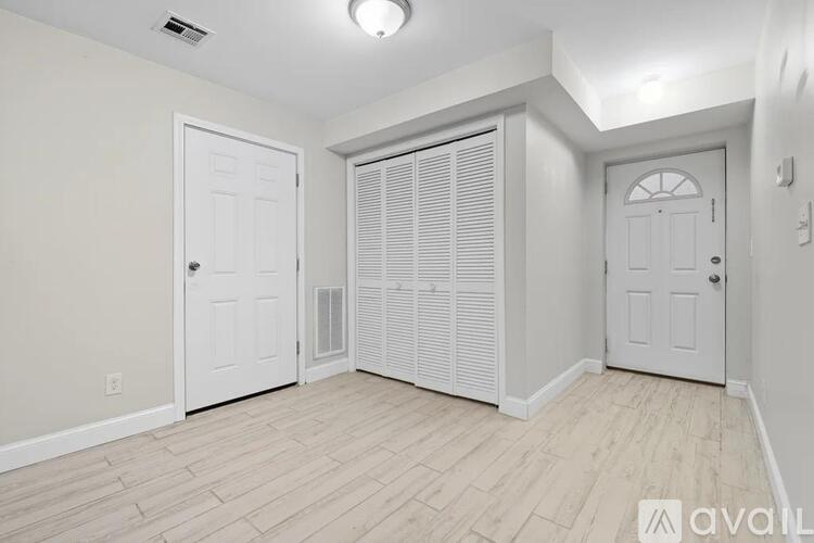 A kitchen with wooden cabinets and a dishwasher.