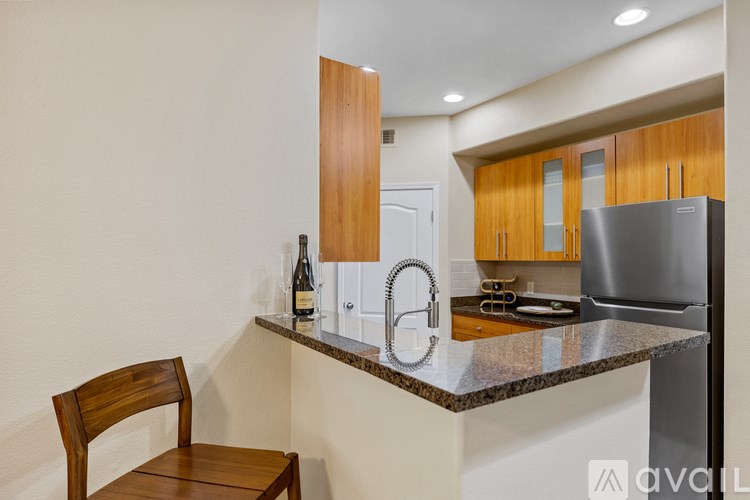 A table with two chairs and a candle holder on it.