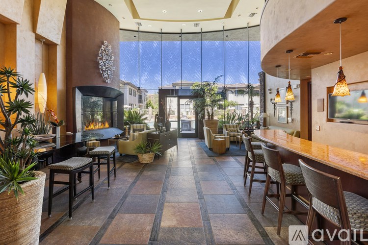 A modern dining area with a glass ceiling and a view of the outdoors.