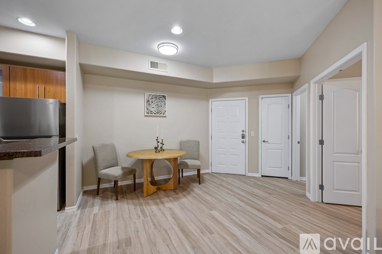 A room with a sliding glass door leading to a balcony.