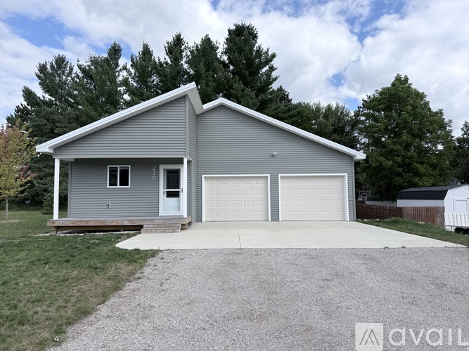 A two-car garage is attached to a house.