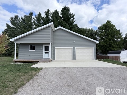 A two-car garage is attached to a house.