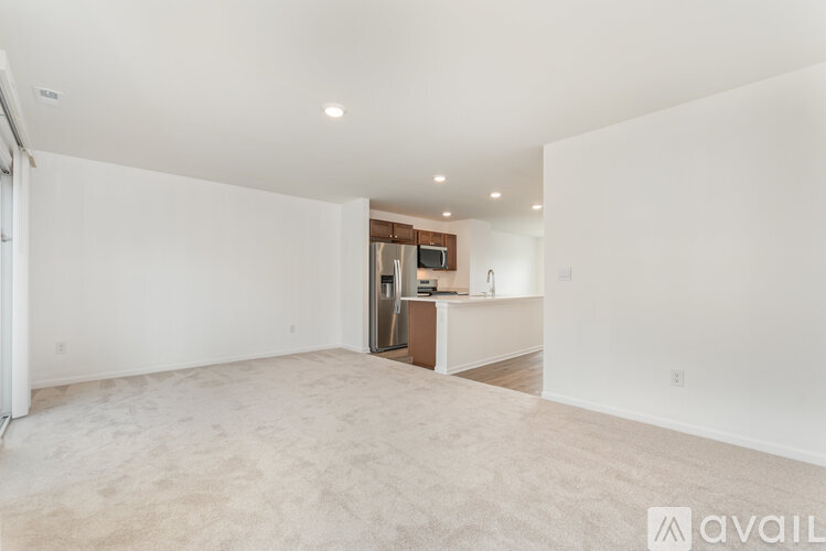 A spacious living room with a television and a cabinet.