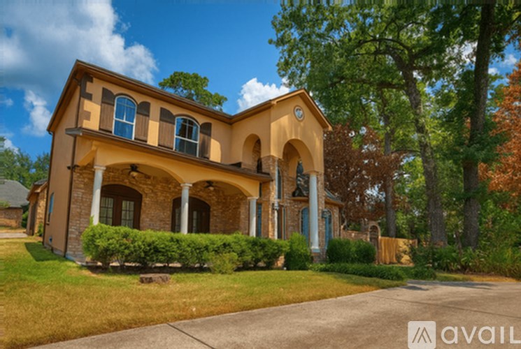 A house with a driveway in front of it.
