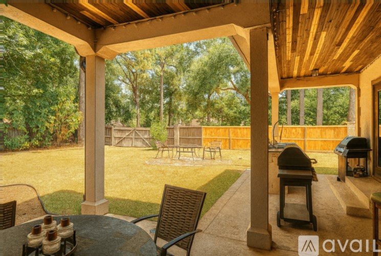 A patio with a table and chairs is shown.