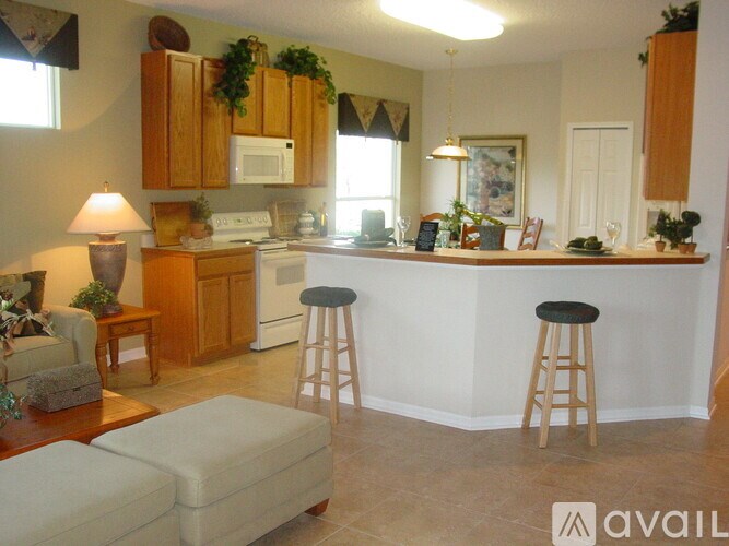 A kitchen with a bar area and a dining table.