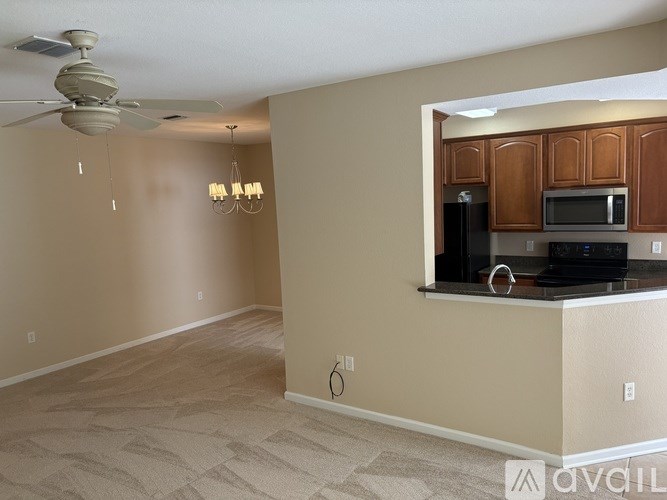 A kitchen area with a counter and appliances.