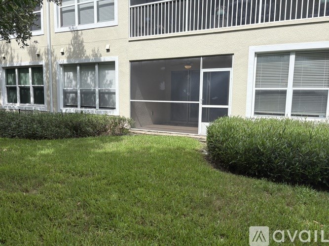 A building with a balcony and a window with blinds.