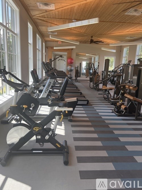 A gym with treadmills and exercise equipment.