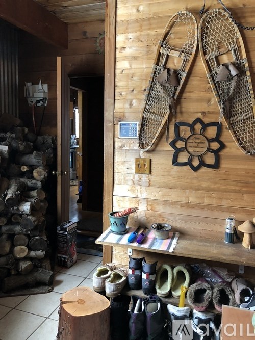 A pair of slippers hanging on a wall in a room.