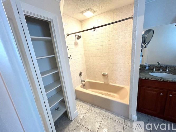 A bathroom with a tub and a walk-in shower.