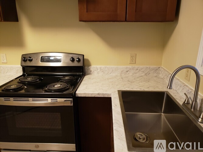 A modern kitchen with a stainless steel stove and oven.