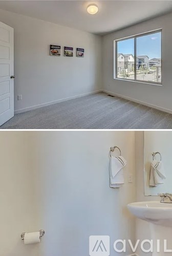A bathroom with a sink and a window.