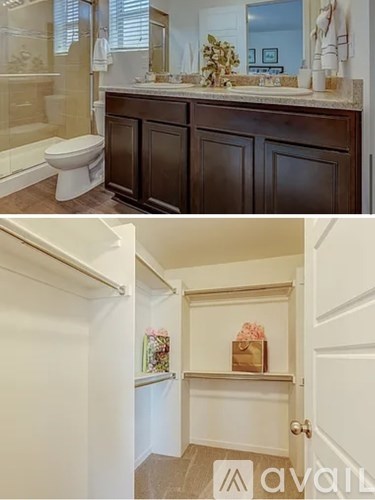 A bathroom with a toilet, sink, and mirror.