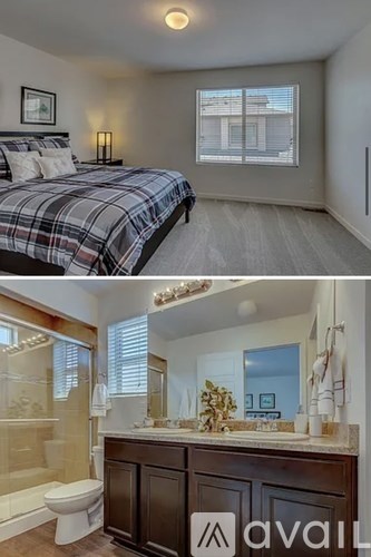 A bedroom with a bed and a bathroom with a toilet and sink.