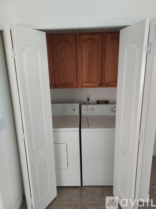 A small kitchen with a washer and dryer built in.