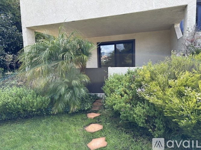 A house with a garden in front of it.