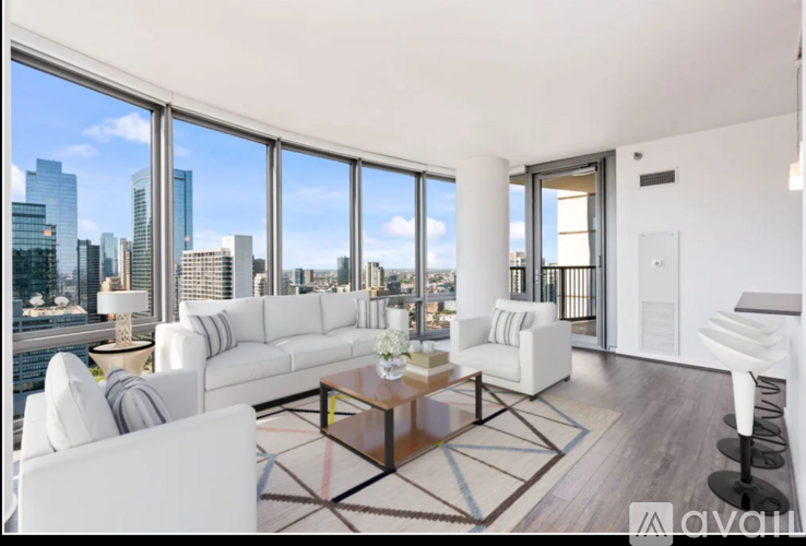 A modern living room with a view of the city skyline.