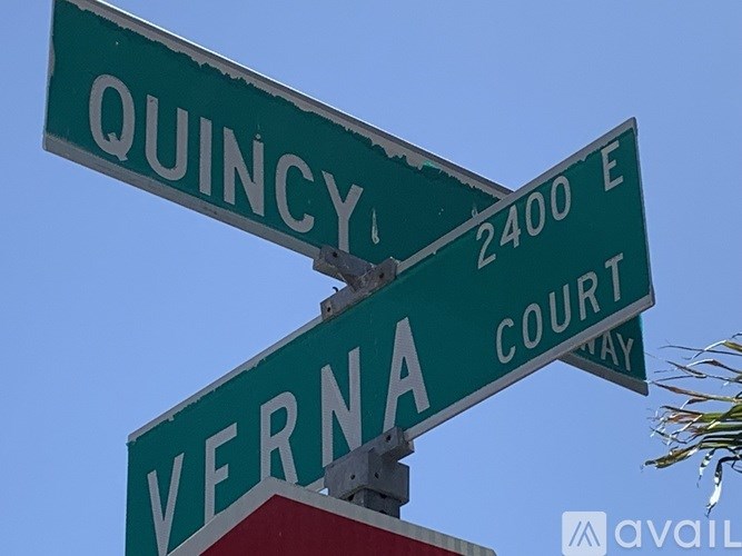 Street sign for Quincy and Verna at the intersection of 2400 E Court Way.