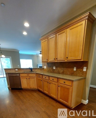 A kitchen with wooden cabinets and a countertop.