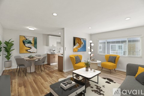 A modern living room with a dining area and a kitchen in the background.