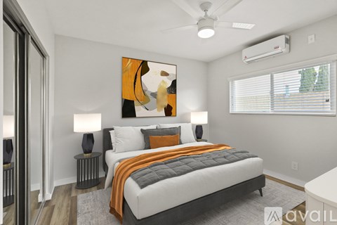 A bedroom with a large bed and a painting on the wall.