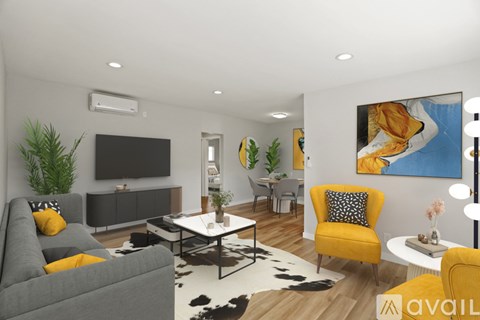 A living room with a grey couch, yellow chair, and a painting on the wall.