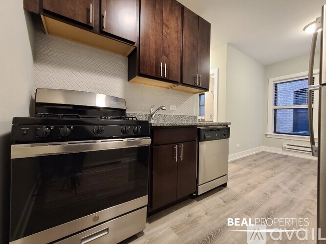 A kitchen with a stove top oven and a dishwasher.