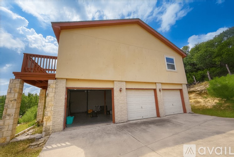 A two-car garage with a balcony is available for rent.