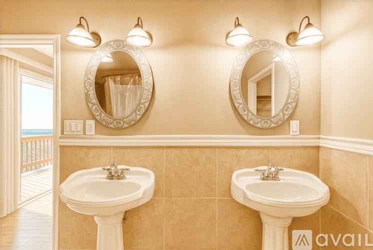 A bathroom with two sinks and two mirrors.